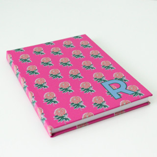 This is a pink journals by Clairebella called custom kyra pink single initial journal in standard