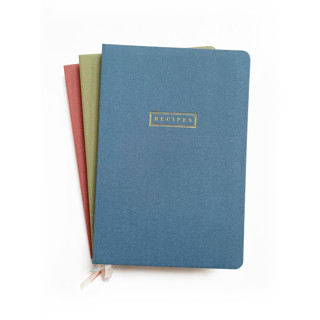 This is a blue journals by Jessica Cunningham called linen recipe book | gold foil on dusty blue linen in standard