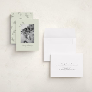 This is a lime holiday photo cards with standard by Angela Garrick called hung holly printing on signature in grand