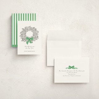 This is a greenery holiday photo cards with standard by mo kelley called wreath with bow printing on signature in grand