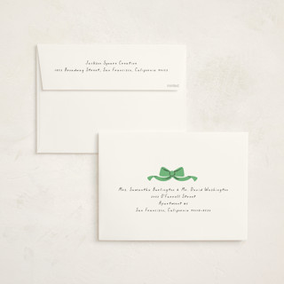 This is a greenery holiday photo cards with standard by mo kelley called wreath with bow printing on signature in grand