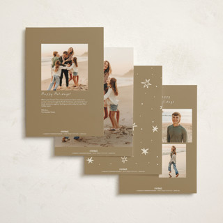 This is a champagne holiday photo cards with standard by Ani Somi called a very merry holiday cheers printing on signature in grand