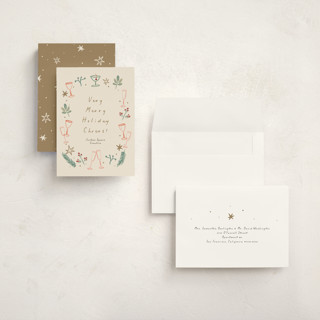 This is a champagne holiday photo cards with standard by Ani Somi called a very merry holiday cheers printing on signature in grand