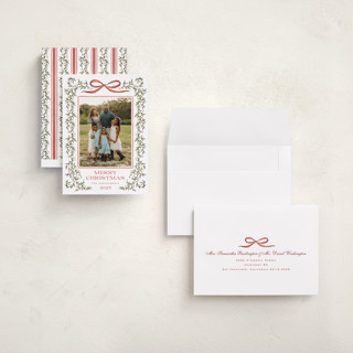 This is a holly berry holiday photo cards with standard by Wildfield Paper Co called laurel wreath printing on signature in grand