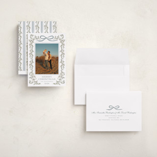 This is a juniper holiday photo cards with standard by Wildfield Paper Co called laurel wreath printing on signature in grand