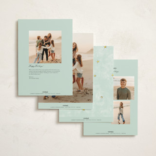 This is a winter rose holiday photo cards with standard by Cass Loh called evergreen magic printing on signature in grand
