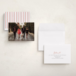 This is a ivory holiday photo cards with standard by Chris Griffith called holiday glee printing on signature in grand