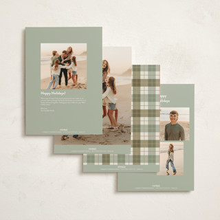 This is a dried orange holiday photo cards with standard by Kate Ahn called book stack printing on signature in grand