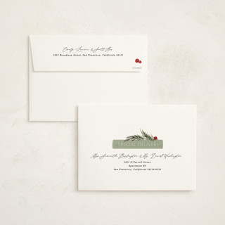 This is a dried orange holiday photo cards with standard by Kate Ahn called book stack printing on signature in grand