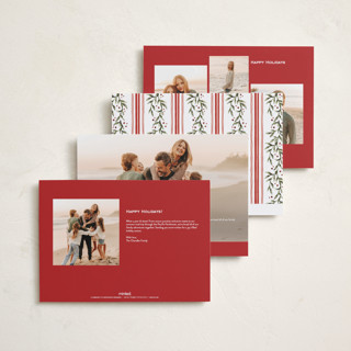 This is a holly berry holiday photo cards with standard by Wildfield Paper Co called laurel wreath printing on signature in grand