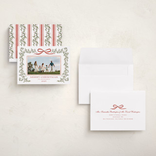 This is a holly berry holiday photo cards with standard by Wildfield Paper Co called laurel wreath printing on signature in grand