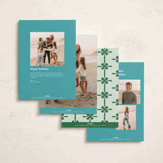 This is a turquoise holiday photo cards with standard by Megan Davis called sleighs printing on recycled smooth signature in grand