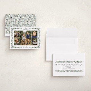 This is a winter berry holiday photo cards with standard by Susan Moyal called holly & pine printing on recycled smooth signature in grand
