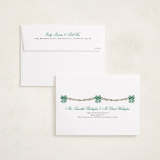 This is a pine holiday photo cards with standard by Susan Moyal called holly & bows printing on recycled smooth signature in grand