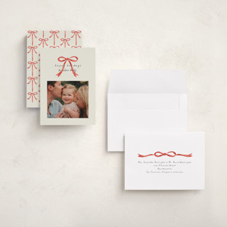 This is a peppermint holiday photo cards with standard by Laura Hankins called painted bow printing on signature in grand