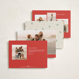 This is a holly holiday photo cards with standard by Sarah Rosenthal called holly tidings printing on signature in grand