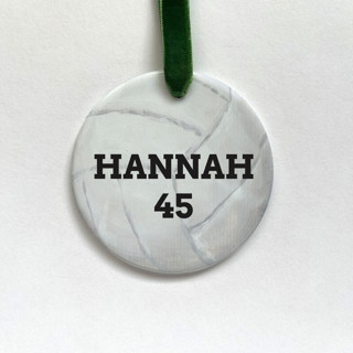This is a white holiday decorations by Holly Whitcomb called personalized volleyball ceramic ornament in standard