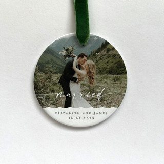 This is a white holiday decorations by Holly Whitcomb called personalized married photo ornament in standard