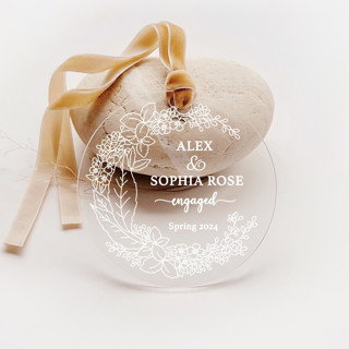 This is a white holiday decorations by Iveta Abolina called personalized acrylic white floral engagement ornament, set of 1 in standard