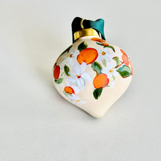 This is a orange holiday decorations by Arohika Verma called orange blossom ornament in standard