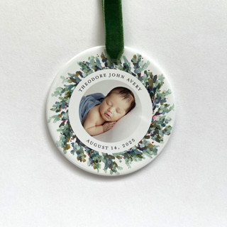 This is a white holiday decorations by Holly Whitcomb called personalized baby photo ornament, painted wreath in standard