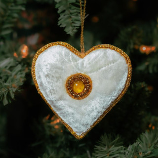 This is a white holiday decorations by Aahlada Chennupati called white zardozi heart ornament in standard