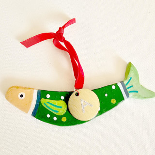 This is a green holiday decorations by AlisonJerry called personalized, hand made green clay sardine ornament in standard