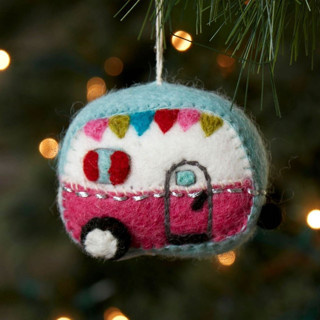 This is a blue holiday decorations by Aahlada Chennupati called felt camper ornament in standard