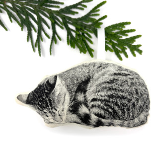 This is a beige holiday decorations by Broderpress called silkscreen sleeping cat ornament in standard