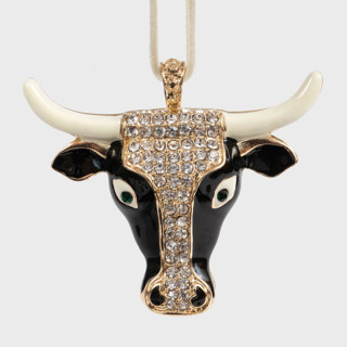 This is a black holiday decorations by Joanna Buchanan called taurus hanging ornament in standard
