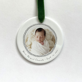 This is a white holiday decorations by Holly Whitcomb called personalized baby photo ornament - scalloped doodles in standard