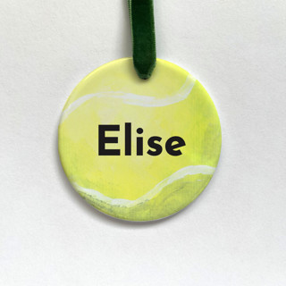 This is a yellow holiday decorations by Holly Whitcomb called personalized tennis ceramic ornament in standard