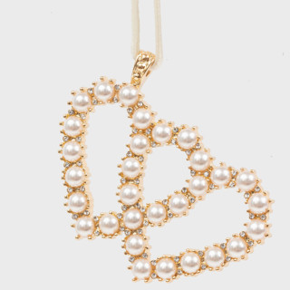 This is a gold holiday decorations by Joanna Buchanan called gemini hanging ornament in standard
