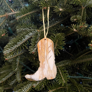 This is a multicolorassorted-colors holiday decorations by Powered By People called sustainable horn handcrafted cowgirl boot ornament in standard