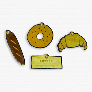 This is a multicolor holiday decorations by Lottie Aldarwish called paper cut out hand painted carb lover ornaments - set of 4 in standard