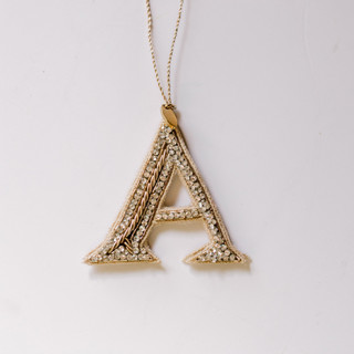 This is a silver holiday decorations by Courtney Bedi called personalized handmade letter ornament - small a in standard