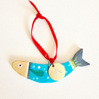 This is a green holiday decorations by AlisonJerry called personalized, hand-made clay turq. sardine ornament in standard