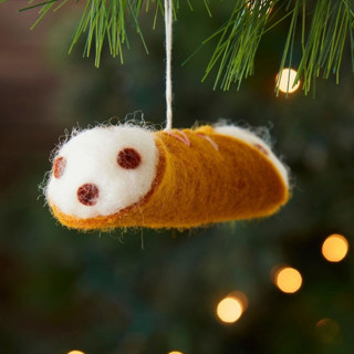 This is a brown christmas ornament by Aahlada Chennupati called Felt Cannoli Ornament in standard.