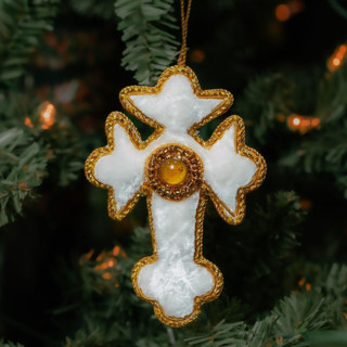 This is a white holiday decorations by Aahlada Chennupati called white zardozi cross ornament in standard