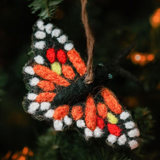 This is a black holiday decorations by Aahlada Chennupati called felt butterfly ornament in standard