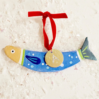 This is a green holiday decorations by AlisonJerry called personalized, hand-made clay blue sardine ornament in standard