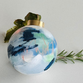 This is a blue christmas ornament by Arohika Verma called Zenith Hand-Painted Ornament in standard.