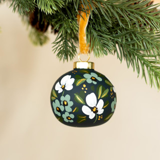 This is a multicolor holiday decorations by Sara Swanson called white and teal blooms - round shaped ornament in standard