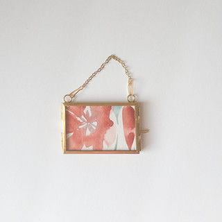 This is a red holiday decorations by Jocelyn Elizabeth called watercolor floral framed ornament 5 in standard