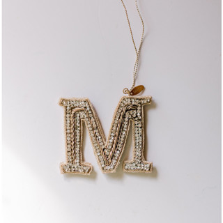This is a silver holiday decorations by Courtney Bedi called personalized handmade letter ornament - large m in standard