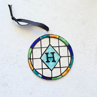 This is a multicolor holiday decorations by Inkspiringletters called faux stained glass ornament- personalized in standard