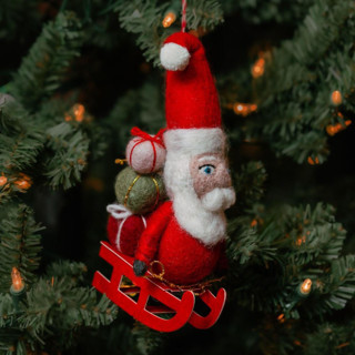 This is a red holiday decorations by Aahlada Chennupati called felt santa claus with gifts ornament in standard
