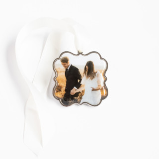 This is a silver holiday decorations by Kimbra Mooers called custom scallop ornament silver in standard