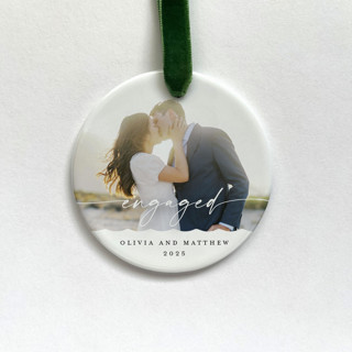 This is a white holiday decorations by Holly Whitcomb called personalized engagement photo ornament in standard