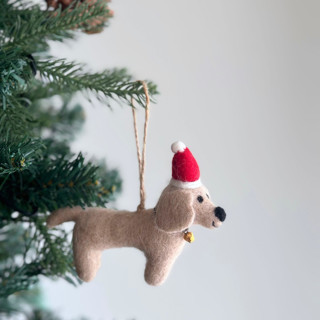 This is a beige holiday decorations by Ganapati Crafts Co. called felt ornament - dachshund dog with christmas hat - cream in standard